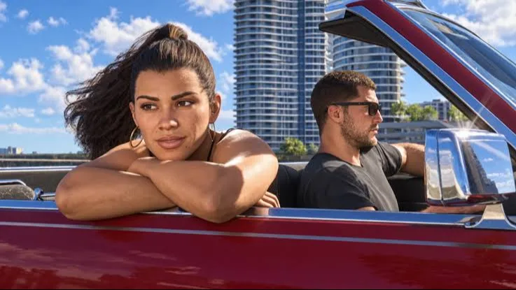 Jason Duval y Lucia Caminos en Vice City mientras un helicóptero transporta parte de una bóveda bancaria en el tráiler de lanzamiento de GTA 6